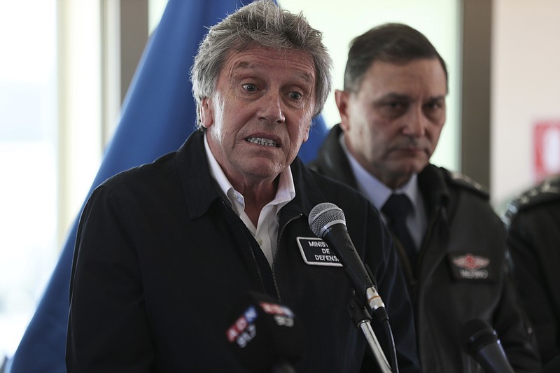 Chile's Defense Minister Alberto Espina speaks during a news conference at the Chilean Air Force base in Punta Arenas, Chile, Thursday, Dec. 12, 2019. Espina said human remains have been found from a military aircraft that disappeared on a flight to Antarctica. The plane was carrying 38 passengers when it took off from southernmost Chile on Monday. (AP Photo/Fernando Llano)