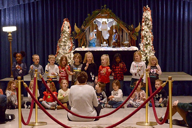 Rachel Ratcliff and her St. Peter Interparish School pre-kindergarten class sing for family and guests Thursday, December 12, 2019, during the Capitol Nativity Scene event in the Capitol Rotunda. 