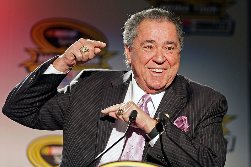 In this Jan. 28, 2014, file photo, Felix Sabates, right, co-owner of Chip Ganassi Racing, speaks during a news conference at the NASCAR Sprint Cup auto racing Media Tour in Charlotte, N.C. Felix Sabates is leaving NASCAR after 30 years as a team owner. His record shows 50 Cup wins, including victories at the crown jewels Daytona 500, Brickyard 400 and NASCAR's All-Star race. (AP Photo/Chuck Burton, File)