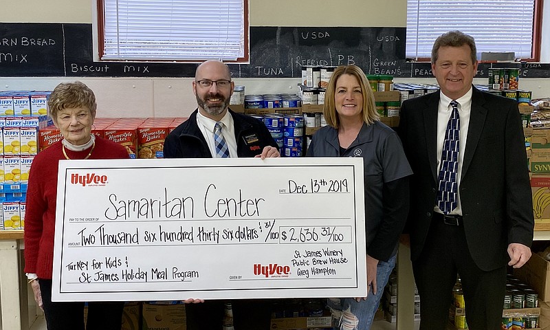 <p>Submitted photo</p><p>Pictured, from left, are Marylyn DeFeo, of the Samaritan Center; Donavan Sigwerth, of Hy-Vee; Beth Hofherr, of St. James Winery; and Greg Hampton, of Major Brands.</p>