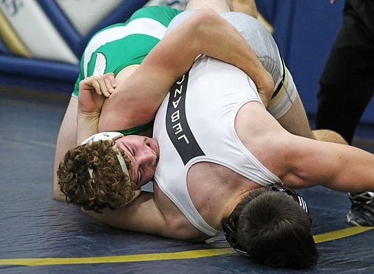 Levi Haney of Blair Oaks works on Lebanon's Jake Henson wrestler near the edge of the mat during a 182-pound match Friday in the Missouri Duals at Rackers Fieldhouse.