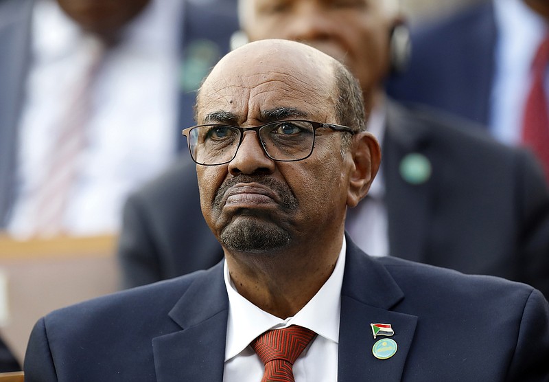 FILE - In this July 9, 2018, file photo, Sudan's President Omar al-Bashir attends a ceremony for Turkey's President Recep Tayyip Erdogan, at the Presidential Palace in Ankara, Turkey. On Saturday, Dec. 14, 2019, a Sudan court convicted al-Bashir of money laundering, sentences him to 2 years in rehabilitation facility. (AP Photo/Burhan Ozbilici, File)