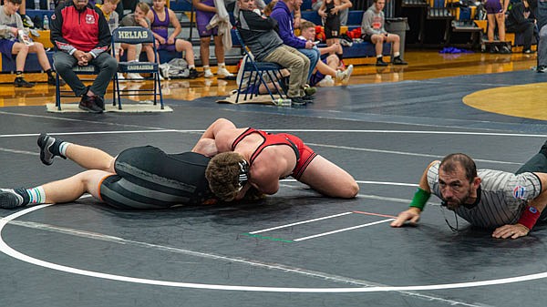 Dawson Prenger of Jefferson City pins Colton Justus of Waynesville during their 182-pound match Saturday at the Missouri Duals in the Helias Gym.