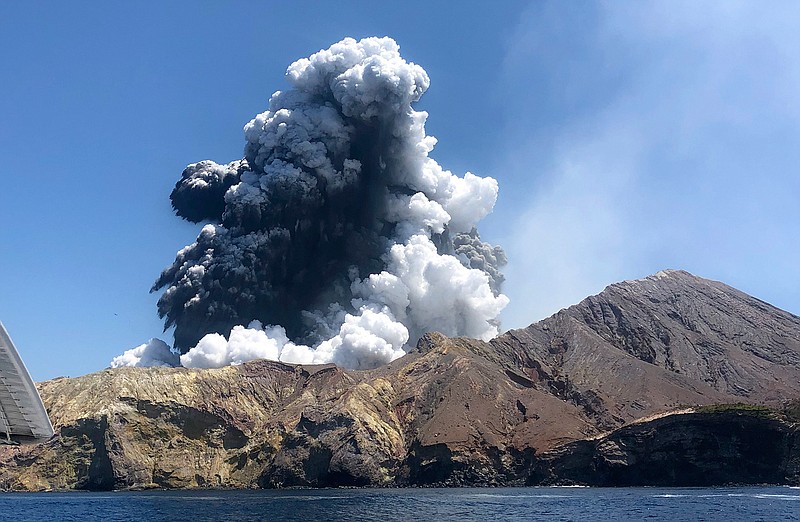 In this Monday, Dec. 9, 2019, file photo provided by Lillani Hopkins, shows the eruption of the volcano on White Island off the coast of Whakatane, New Zealand. (Lillani Hopkins via AP, file)