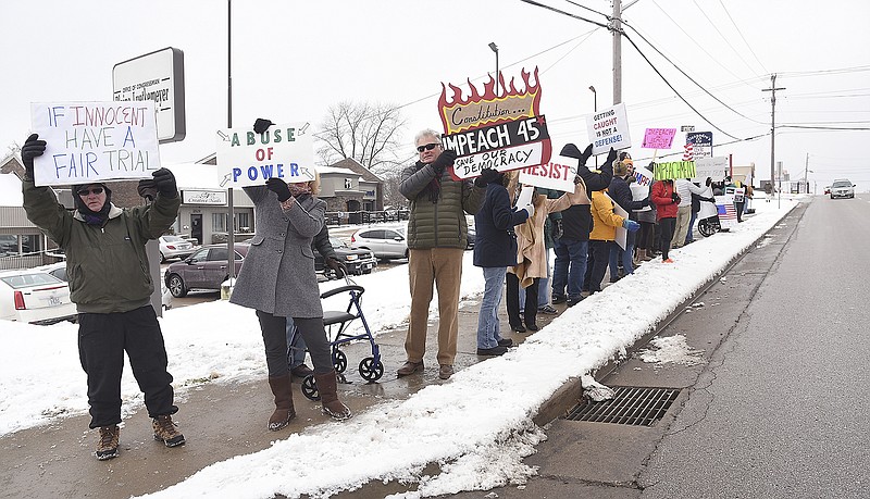 FILE: About 40 people with Jefferson City Area Indivisible held a rally Dec. 17, 2019, in front of Congressman Blaine Luetkemeyer's office on Missouri Boulevard. The group was there to demand President Donald Trump be impeached. Volunteers were out Wednesday demanding Republicans be held accountable for denying opportunities to have witnesses during the impeachment trial as part of the national "Reject the Cover-up" protest. Trump was acquitted Wednesday.