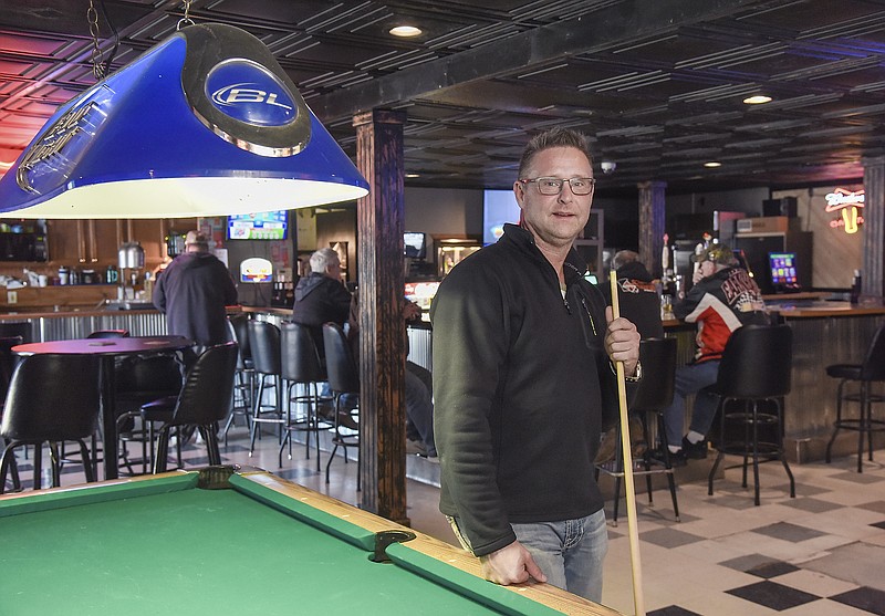 Julie Smith/News Tribune
Scott Drinkard poses inside the The Off Ramp, the bar formerly known as Jamey's, located at the intersection of W. McCarty Street and the U.S. 54/63 offramp. 