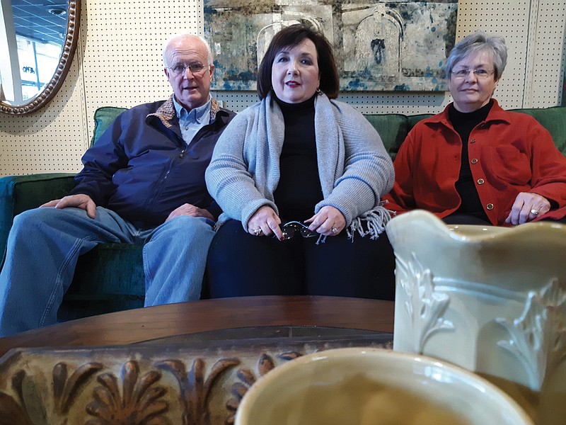 Gary McNatt, Lynn McNatt and Linda McNatt, co-owners and managers of Moore's Home Furnishings, look to the next stage of their lives as they close the furniture store. 