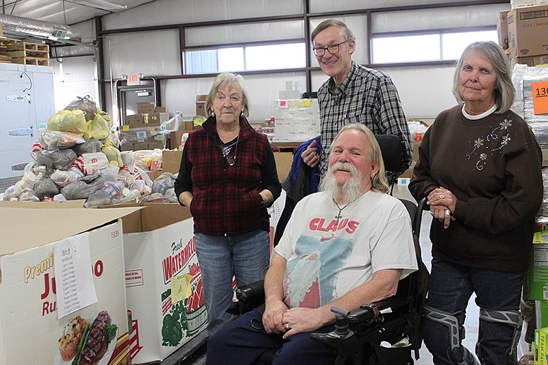 Cooperation, communication and teamwork are all needed in order to conduct MCMC's Cargill Cares Food Pantry and the adjoining Project Share Resale Shop. Behind the scenes of caring for Moniteau County families in need are, from left, Judy Barbour, of Project Share; MCMC board member Steve Miller; and Cargill Cares Food Pantry managers Max Wachter and Barb Mannering.