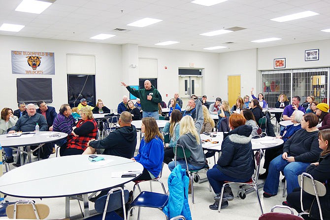 Jeffrey Times stands to explain why he supports the proposed switch to a four-day school week for students at New Bloomfield R-3. Wednesday night's forum brought impassioned arguments on both sides of the issue from parents, faculty and board of education members.