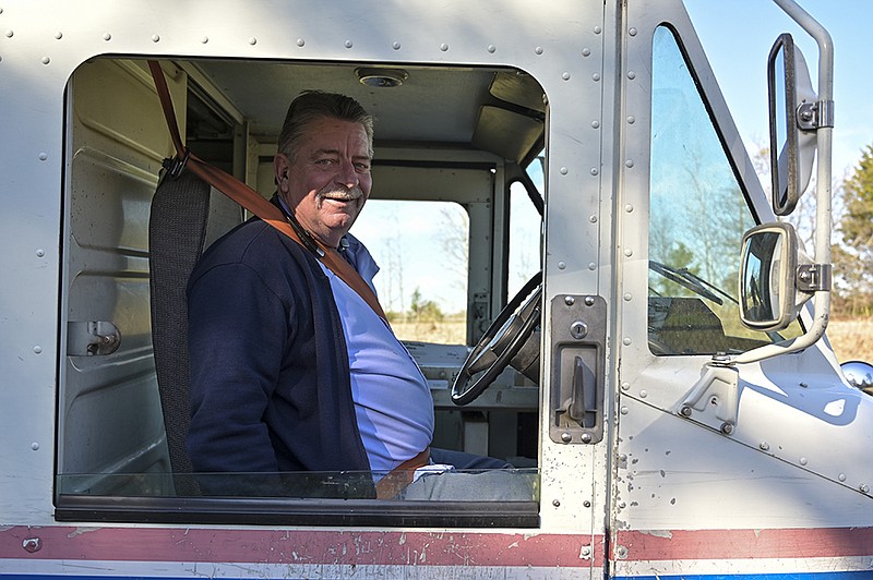 Joe Davidson poses for a portrait on Thursday, Dec. 19, 2019, in Texarkana, Texas. Davidson has driven 2 million miles safely on his mail routes without any accidents during his career with the United States Postal Service. 