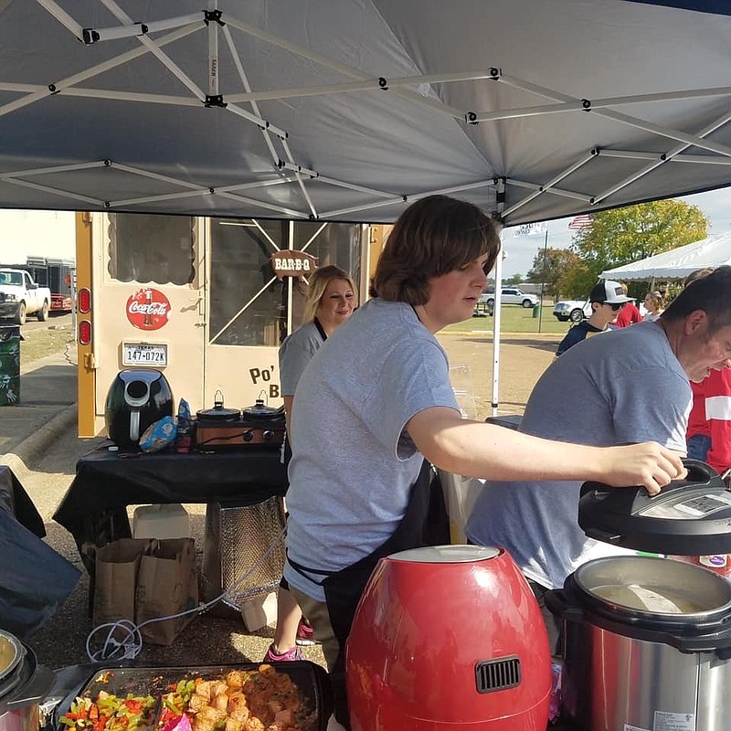 TJ Woodruff, owner of TXKVegan, serves vegan dishes at this year's Front Street Food Fest. Woodruff said vegan food is an unusual thing for Texarkana, but the response has been enthusiastic. Right now, he regularly occupies a space downtown. The next step for the 18-year-old will be a food truck. (Submitted photo)