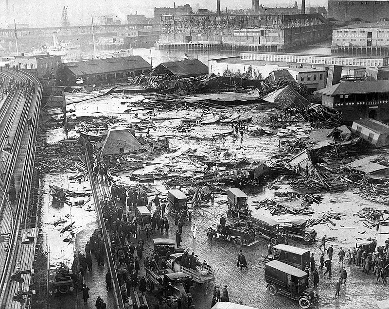 This photograph shows the aftermath of the Great Molasses Flood on Jan. 15, 1919, along Commercial Street in Boston. An 8-foot wave of the syrupy brown liquid moved down the street at a speed of 35 mph and killed 21 people. (Boston Public Library)
