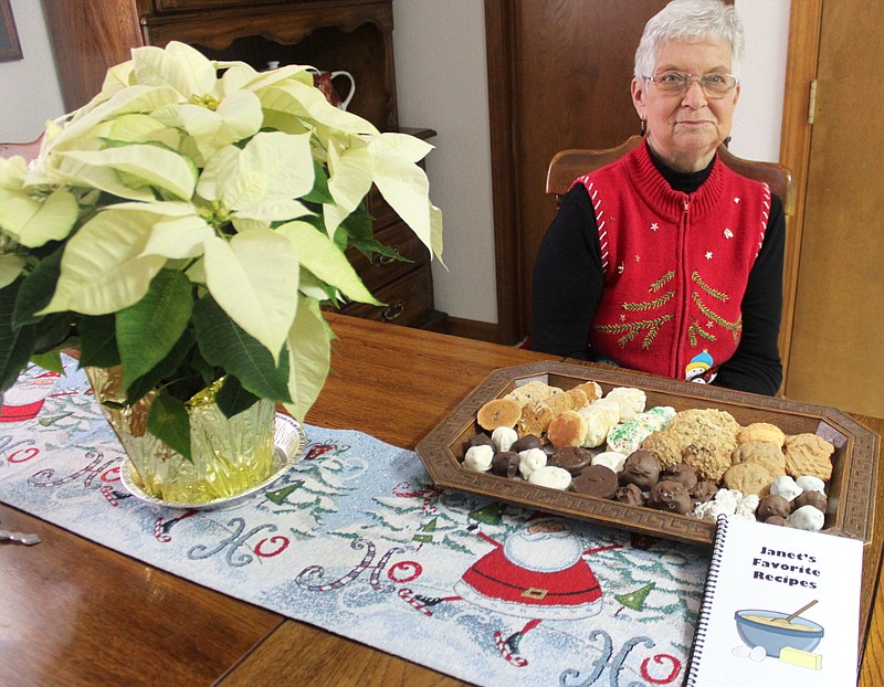 <p>Democrat photo/Liz Morales</p><p>Janet Anderson sits next to her latest cookie baking haul for the 2019 Christmas season. Anderson, who bakes cookies for California area residents who may need extra holiday cheer, has continued this tradition for 41 years.</p>