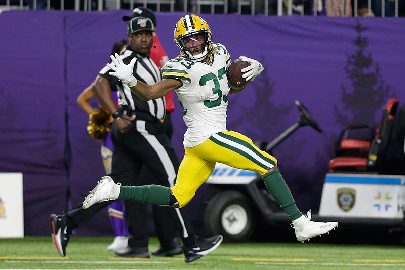 Green Bay Packers running back Aaron Jones runs for a 56-yard touchdown during the second half of the team's NFL football game against the Minnesota Vikings, Monday, Dec. 23, 2019, in Minneapolis. (AP Photo/Andy Clayton-King)