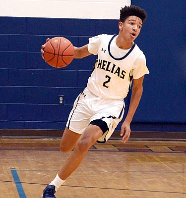 Desmond White of Helias brings the ball up the court during a game against Republic earlier this season at Rackers Fieldhouse.