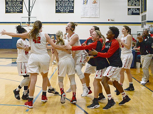 The Jefferson City Lady Jays celebrate after winning the holiday tournament title last year at Rackers Fieldhouse.