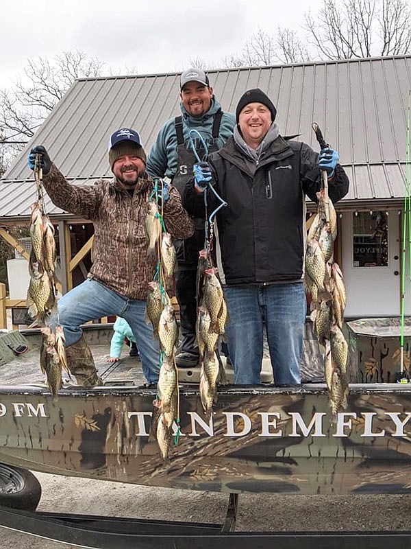 Brandon Butler, Kris Nelson and Nathan "Shags" McLeod show off their three-man limit of 45 crappie caught in two hours.