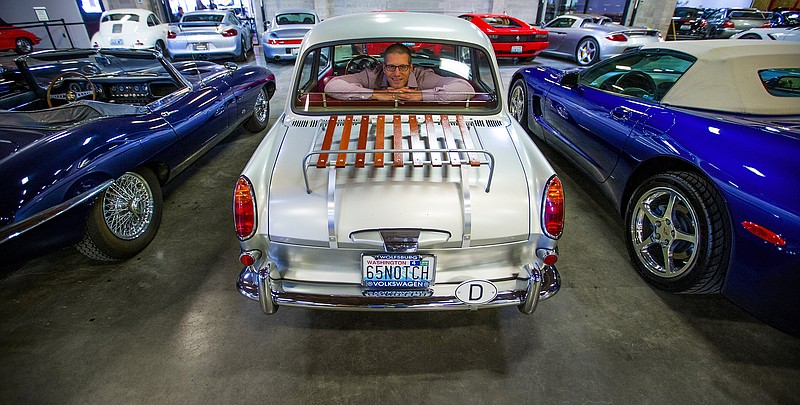 Matt Bell, owner of The Shop, just east of Seattle's SoDo neighborhood, sits in the back seat of a 1965 Volkswagen Notchback. The Shop is a car club, with storage, mechanics and a community that caters to the area's growing car enthusiasts. (Mike Siegel/Seattle Times/TNS)