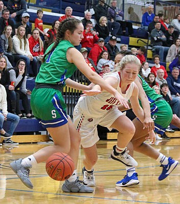 Brooke Bates of Jefferson City reaches for the ball during Sunday's title game against Blue Springs South in the Jefferson Bank Holiday Hoops Classic at Rackers Fieldhouse.