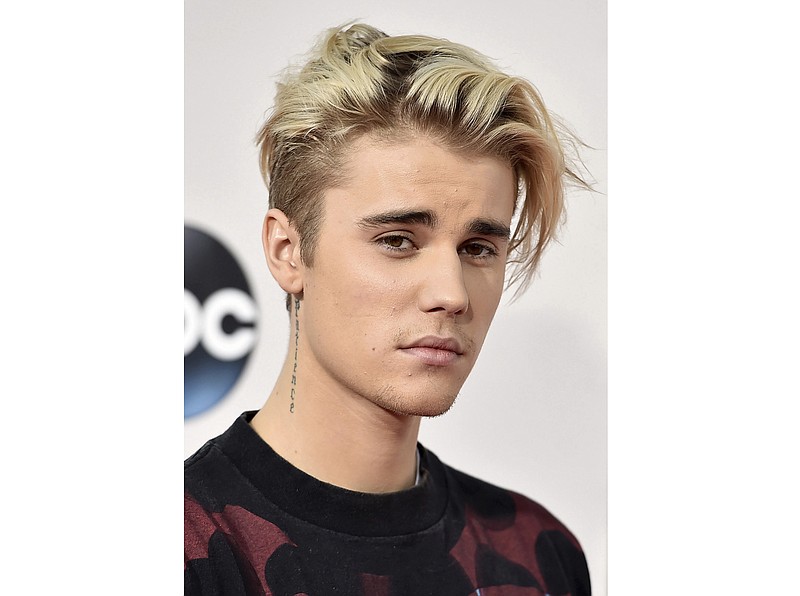 FILE - This Nov. 22, 2015 file photo shows Justin Bieber at the American Music Awards in Los Angeles. Bieber is a launching a docu-series about creating his new album on YouTube, the platform the singer originally got his start in music over a decade ago. YouTube announced Tuesday that “Justin Bieber: Seasons” will debut on Jan. 27 and the 10-episode series will follow the pop star while he records his first new album since 2015. (AP Photo by Jordan Strauss/Invision/AP)