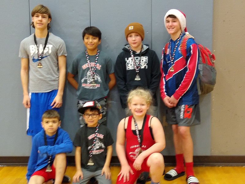 <p>Submitted</p><p>The Central Missouri Wrestling Club had eight children place Dec. 22 at the Columbia Novice Wrestling tournament. Pictured in the back row, from left, are Layne Tiberghien, Enrique Vaughn, Evan Ragsdale and Dalton Doss. In the front row, from left, are Clayton Tiberghien, Alex Vaughn and Kendall Ragsdale. Not pictured is Henry Collier.</p>