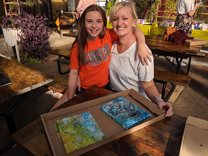 A mother and daughter pose with their artwork from a recent event local artist and art teacher Shea Phillips presented in Shreveport, La. (Submitted photo)
