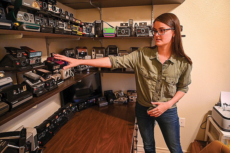 Maddy Green talks about her Polaroid camera collection at her home in Texarkana, Texas. 
