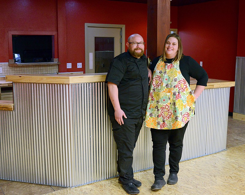 Owner Amanda Jensen stands with her husband and chef, Greg Atkinson, Tuesday, Dec. 31, 2019, inside the new location for La Chica Loca on East High Street in downtown Jefferson City. 