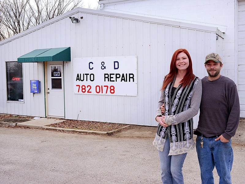 Chris and Devin Wilkerson stand together Thursday, Jan. 2, 2020, outside C&D Auto Repair in Russellville. 