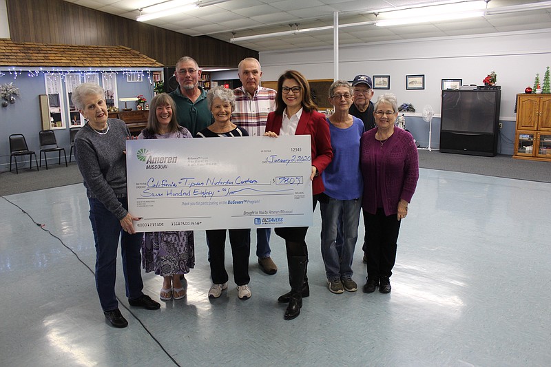 Lori Hoelscher, regional account executive with Ameren, presented a donation check to members of the California and Tipton nutrition centers Jan. 2, 2019, at the California Nutrition Center. In the back row, from left, Robert Zimmerman, California Board Vice President Clint Carlyle and Jim Plaster. In the front row, from left, California Board President Dee Butts, Jan Kurowski, Frances Proffit, Hoelscher, Tipton cook and administrator Carol Fellows and Tipton Board Treasurer Mary Williamson.