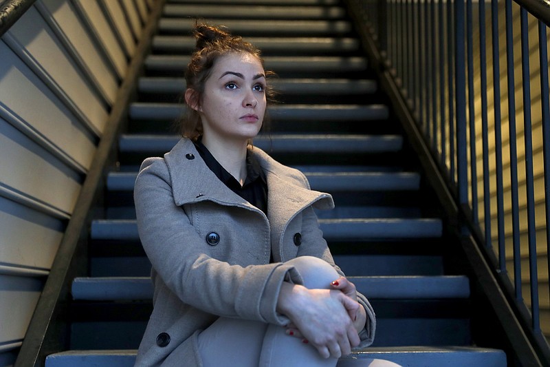 In this Dec. 13, 2019, photo, Caroline Miller poses for a photo in Cartersville, Ga. Miller is one of more than a dozen women who jointly filed a lawsuit against Lyft after she says she was raped by a driver after a night out celebrating her birthday. (AP Photo/John Bazemore)