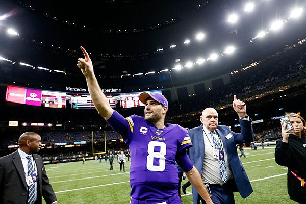 Vikings quarterback Kirk Cousins reacts as he walks off the field after Sunday's overtime win against the Saints in an NFL wild-card playoff game in New Orleans.