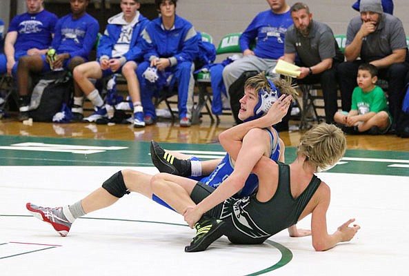 Sterling Wheatley of Capital City holds down Connor Green of North Callaway in their 113-pound match Tuesday night at the Blair Oaks Middle School in Wardsville.
