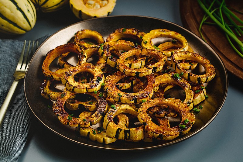 JeanMarie Brownson, Acorn squash with cheesy rice and poblanos and the Roasted delicata squash rings styled by Shannon Kinsella, Thursday, Dec. 12, 2019. (E. Jason Wambsgans/Chicago Tribune/TNS)