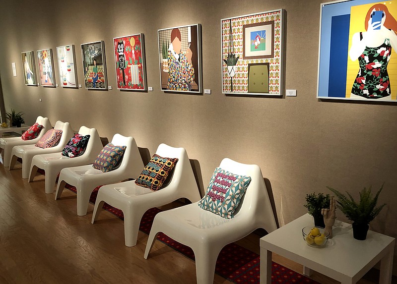<p>Olivia Garrett/For the News Tribune</p><p>Digital illustrations and pillows inscribed with hopeful mantras line the walls of the annual faculty art show at William Woods University. The works represent a “utopian version” of what she wants life to be, said graphic design professor Bethanie Irons. </p>