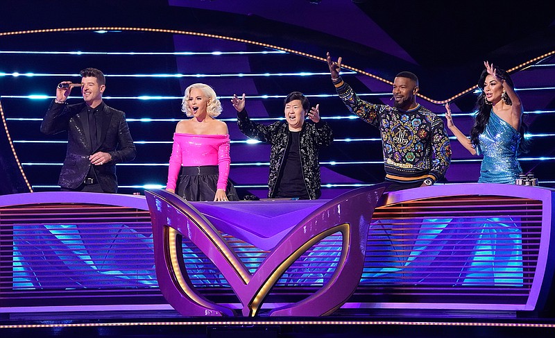 From left to right: Robin Thicke, Jenny McCarthy, Ken Jeong, guest panelist Jamie Foxx and Nicole Scherzinger in "The Masked Singer." (The Greg Gayne /FOX/TNS)