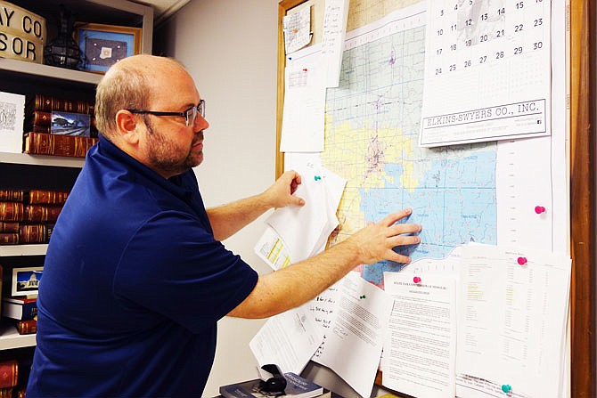 FILE: Callaway County Assessor Jody Paschal indicates parts of the county affected by the latest round of reassessments. Some 7,888 notices of increased assessed value have been sent out over the last month, he said. A number of Callawegians claim they were unfairly issued late fees despite turning their assessment forms in on time.