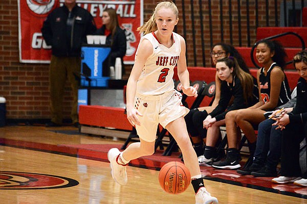 Jefferson City's Addison Morgan dribbles the ball up the court during Friday's game against Waynesville at Fleming Fieldhouse.