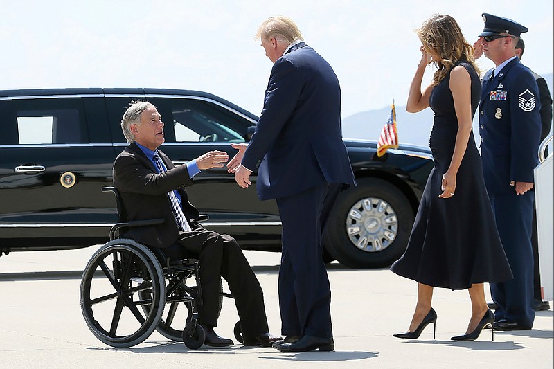 In this Aug. 7, 2019 file photo, President Donald Trump and Melania Trump greet Texas Gov. Greg Abbott after arriving in El Paso, Texas. Abbott says the state will reject the re-settlement of new refugees, becoming the first state known to do so under a recent Trump administration order. In a letter released Friday, Jan, 10, 2020, Abbott wrote that Texas "has been left by Congress to deal with disproportionate migration issues resulting from a broken federal immigration system." He added that Texas, which typically takes in thousands of refugees each year, has done "more than its share." Governors in 42 other states have said they will consent to allowing in more refugees, according to the Lutheran Immigration and Refugee Service.(Mark Lambie/The El Paso Times via AP, File)