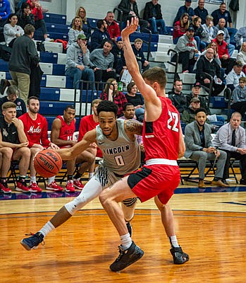 Cameron Potts of Lincoln tries to drive around Matt Wilkinson of Central Missouri during Saturday afternoon's game at Jason Gym.