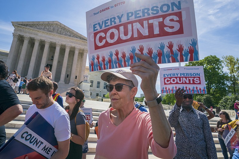 FILE - In this April 23, 2019 file photo, immigration activists rally outside the Supreme Court as the justices hear arguments over the Trump administration's plan to ask about citizenship on the 2020 census, in Washington. The Department of Homeland Security is agreeing to share citizenship information with the U.S. Census Bureau. The agreement was made in response to President Donald Trump's order to collect data on who is a citizen through administrative records following the Supreme Court's rejection of a citizenship question on the 2020 Census form.  (AP Photo/J. Scott Applewhite, File)