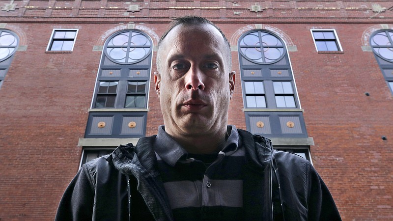 David Meehan, lead plaintiff in a class-action lawsuit accusing the State of New Hampshire of covering up decades of sexual, physical and emotional abuse at its youth detention center, poses outside his lawyer's office in Portsmouth, N.H., Friday, Jan. 10, 2020. Meehan accuses three staffers, one who later worked for the Boston Red Sox, of sexually assaulting him, and others of witnessing and enabling the abuse. (AP Photo/Charles Krupa)