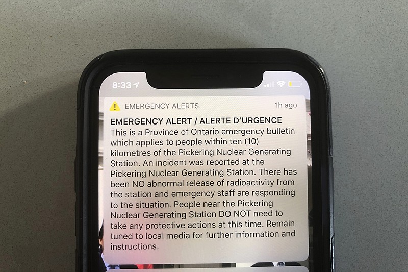 An emergency alert issued by the Canadian province of Ontario reporting an unspecified “incident” at a nuclear plant is shown on a smartphone Sunday, Jan. 12, 2020. Ontario Power Generation later sent a message saying the alert “was sent in error."  The initial message said the incident had occurred at the Pickering Nuclear Generating Station, though it added there had been no abnormal release of radioactivity from the station. (AP Photo/Robert Gillies)