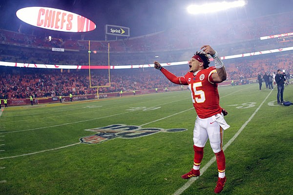 Chiefs quarterback Patrick Mahomes celebrates with fans as he comes off the field after Sunday's 51-31 victory against the Texans at Arrowhead Stadium.