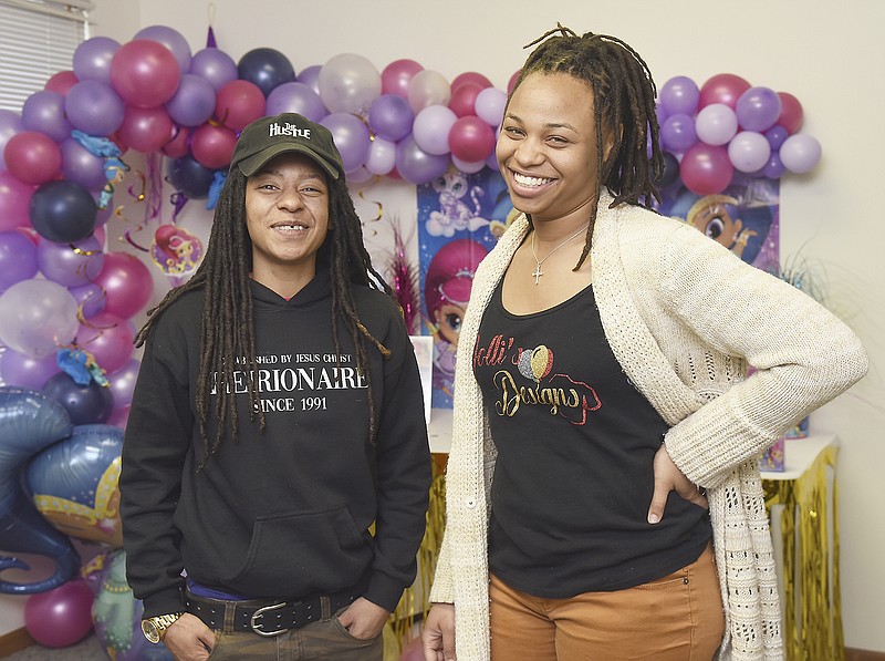 Treana Cason, left, and Shalina Reed of Dolli's Designs pose for a photograph in their East High Street office. 