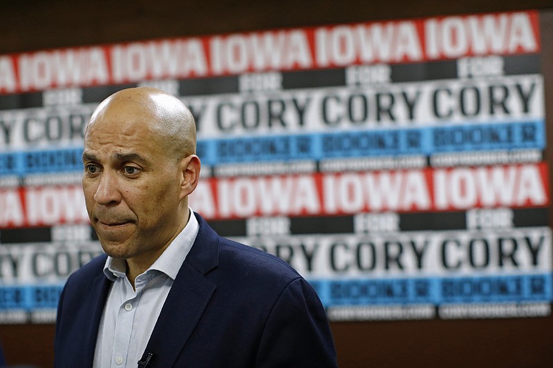 FILE - In this Jan. 9, 2020 file photo, Democratic presidential candidate Sen. Cory Booker, D-N.J., speaks with attendees after a campaign event in Mount Vernon, Iowa. Booker has dropped out of the presidential race after failing to qualify for the December primary debate.  (AP Photo/Patrick Semansky)