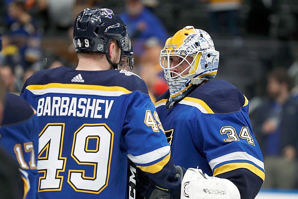 Blues goaltender Jake Allen celebrates with teammate Ivan Barbashev after Monday night's 4-1 win against the Ducks in St. Louis.
