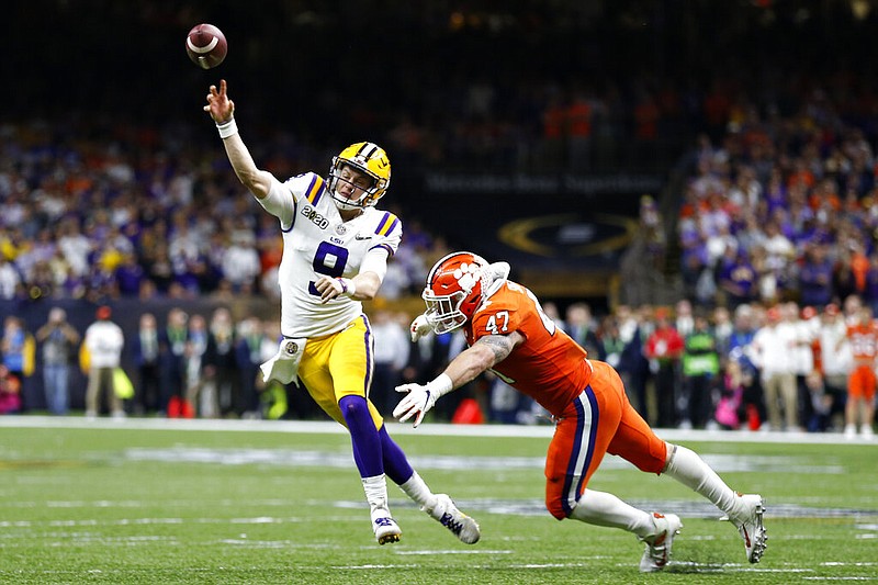 LSU quarterback Joe Burrow passes under pressure from Clemson linebacker James Skalski during the first half of a NCAA College Football Playoff national championship game Monday, Jan. 13, 2020, in New Orleans. (AP Photo/Gerald Herbert)