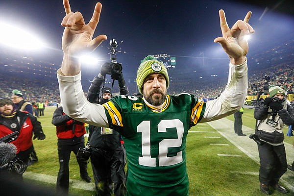 Packers quarterback Aaron Rodgers celebrates as he walks off the field after Sunday's NFL divisional playoff game against the Seahawks in Green Bay, Wis.