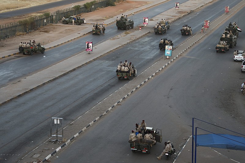 Members of the Rapid Support Forces, a paramilitary force operated by the Sudanese government, block roads in Khartoum, Sudan, Tuesday, Jan. 14, 2020. A Sudanese official said Tuesday that security forces have contained an armed protest from within the security apparatus, amid reports of unrest. (AP Photo)